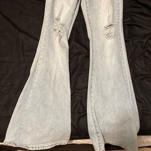 fit and flare jeans with rips at the knees